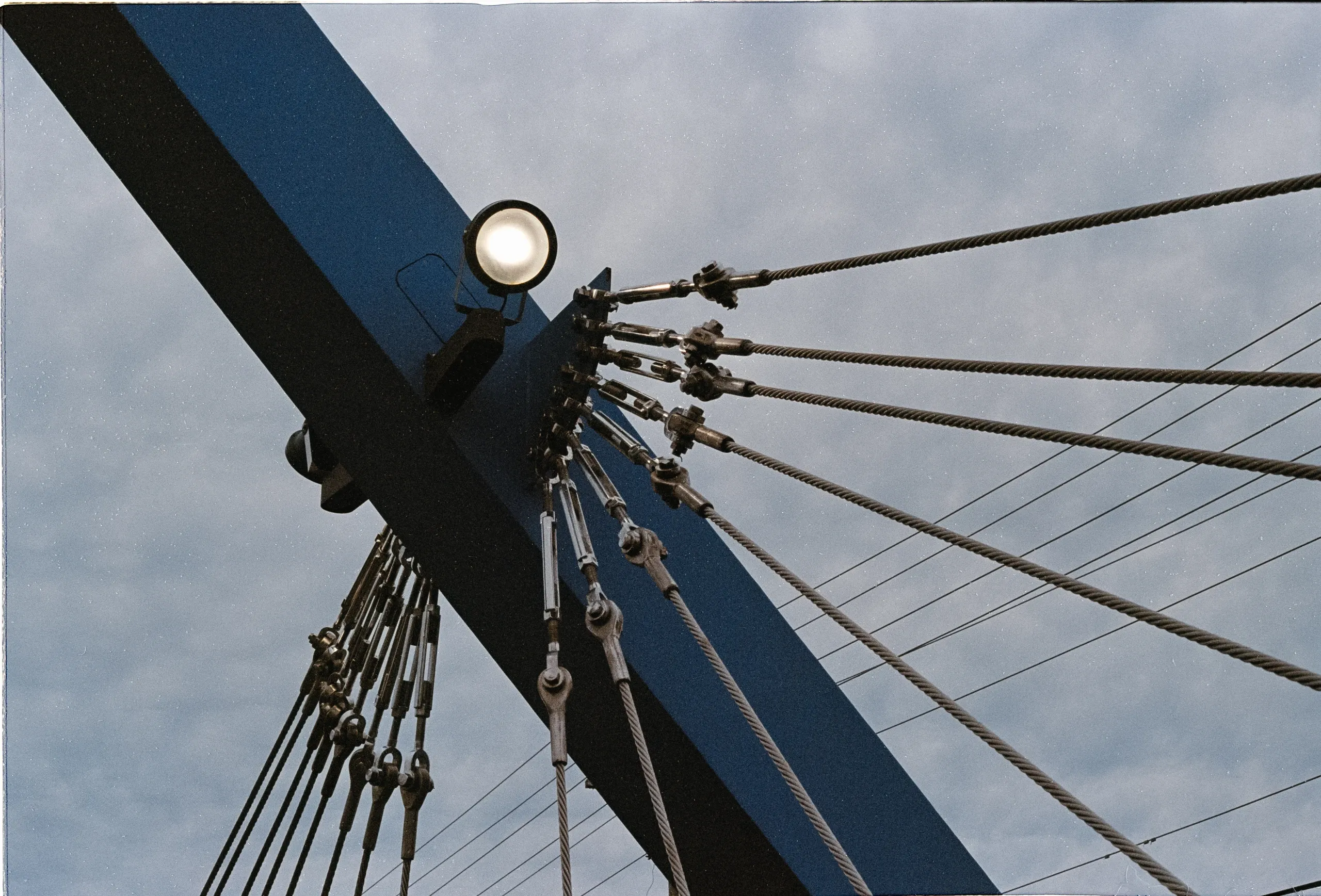 Grey bridge against a blue sky.